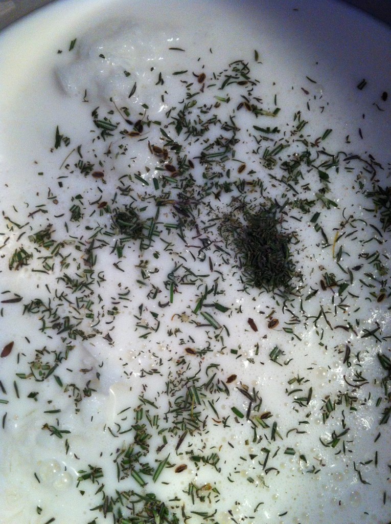 milk and herbs in the pot