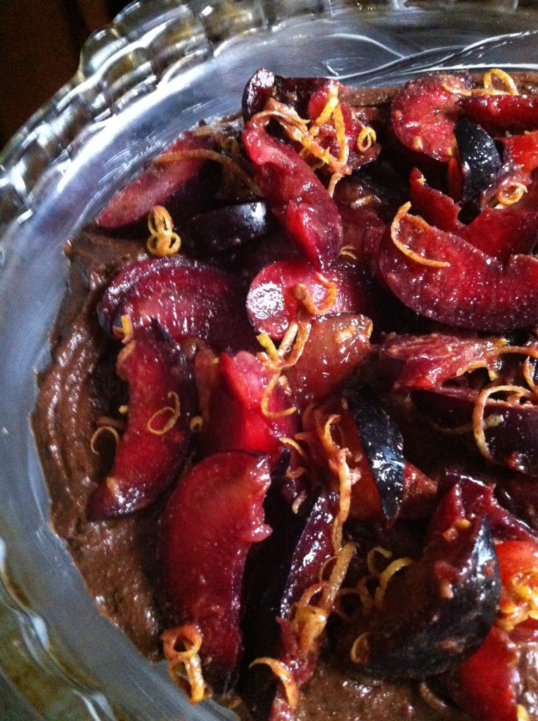 spiced lemony plums atop the batter
