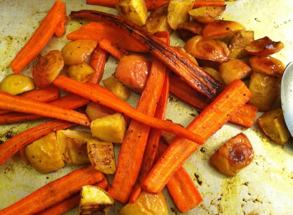 the captivating fragrance of coconut oil and curry roast carrots and apples